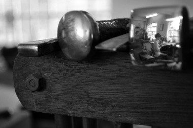 Reflection of Theresa's Workshop in a hammer head
