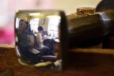 Reflection of Theresa Nguyen in a hammer head